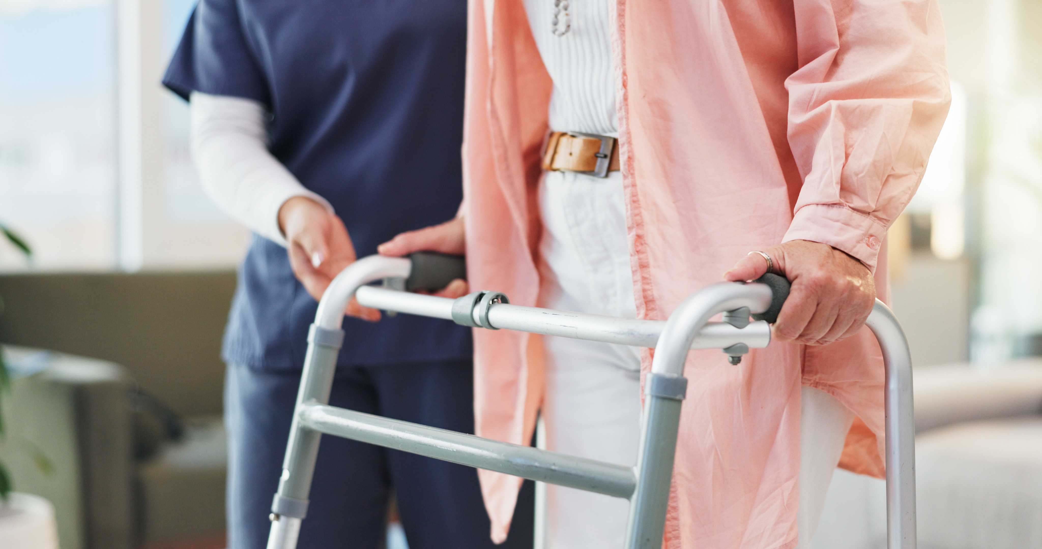 A patient walking with support during rehabilitation